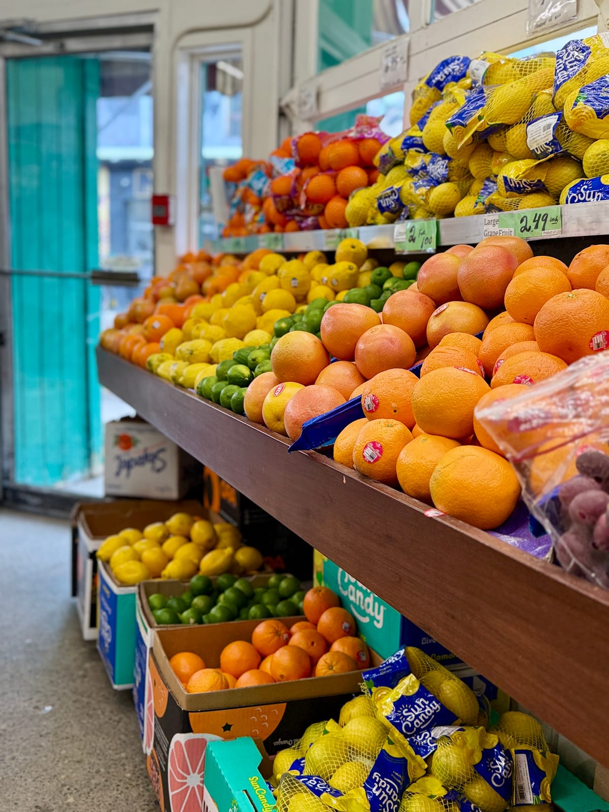 Colourful display of fresh citrus and tropical fruits at a Toronto grocery store